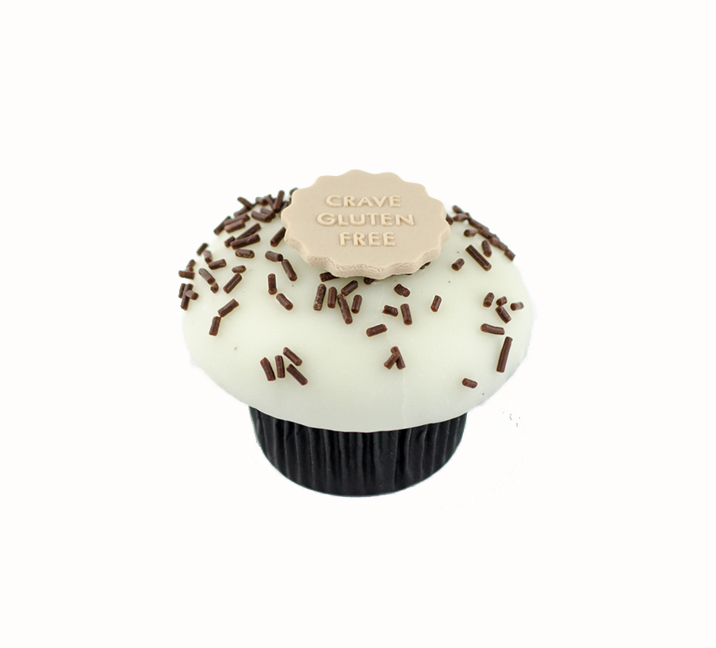 We bake our cupcakes fresh daily. (Shown: Gluten Free Vanilla on Chocolate (*no special decorations avail) cupcakes.)